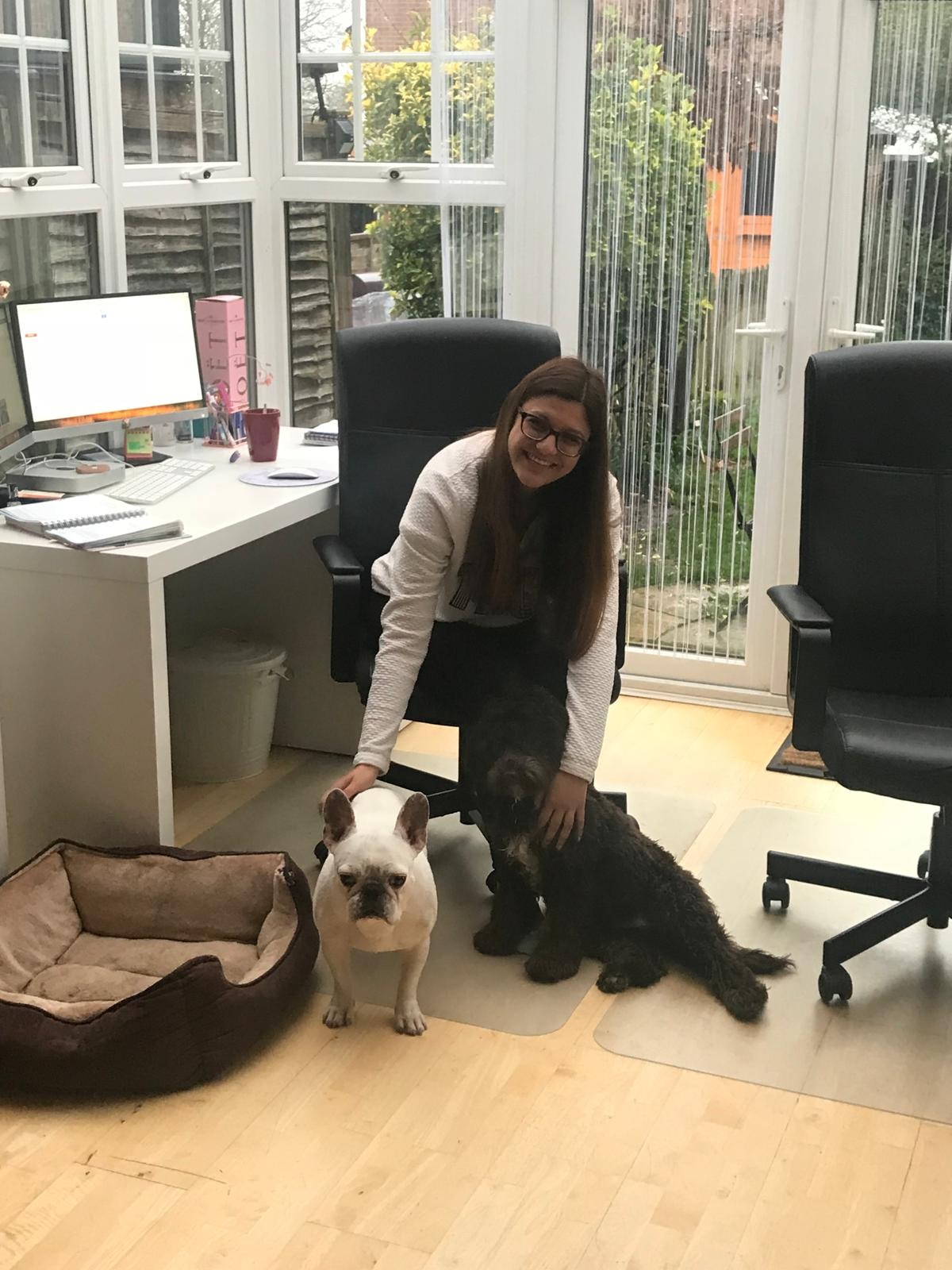 Sonia in the early office with two dogs